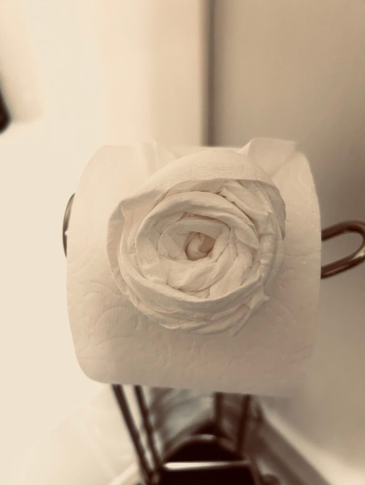Elegant toilet paper rose — our signature finishing touch